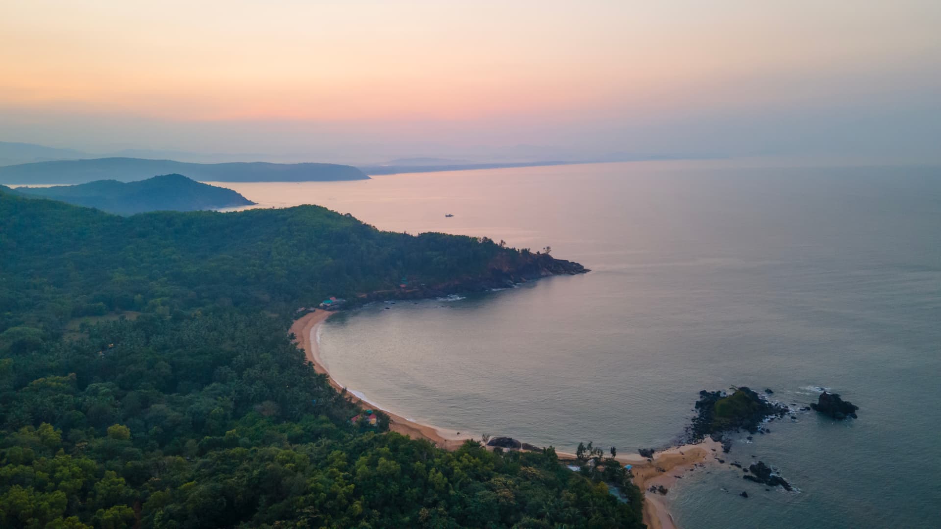 SwaSwara, CGH Earth — Om Beach coastline at dusk, Gokarna