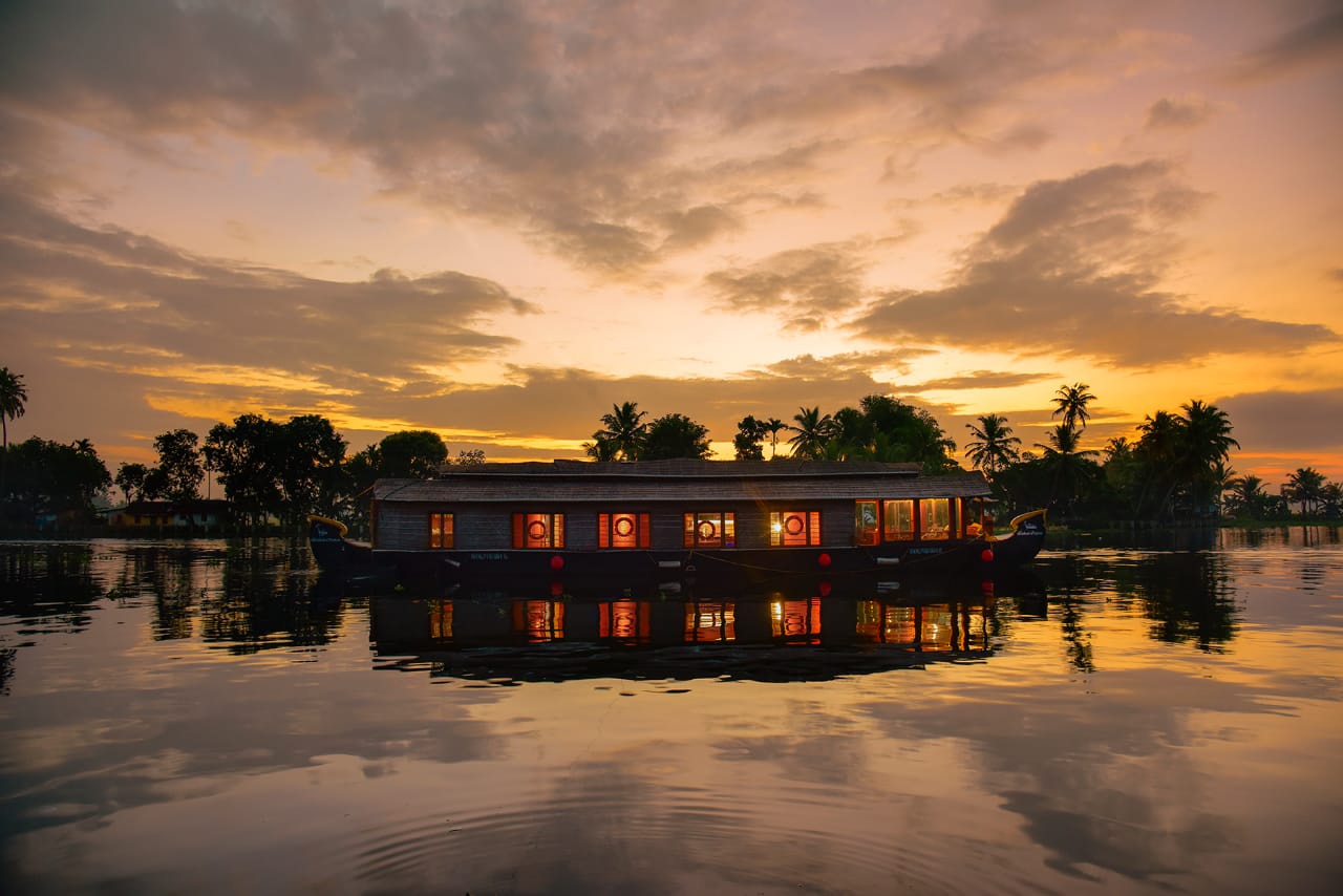 Abad Cruise on the Lake — houseboat at sunset